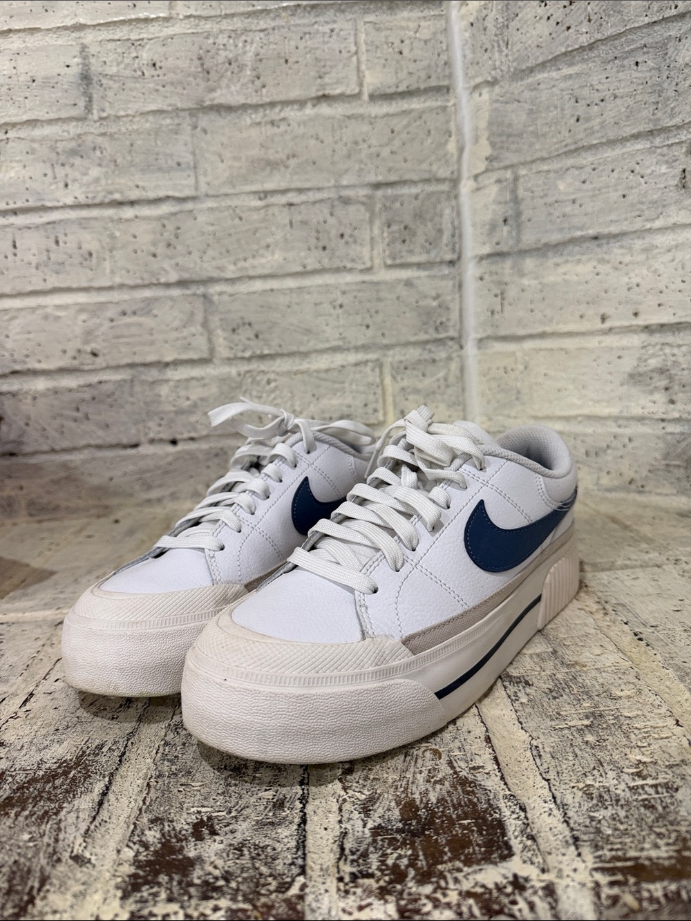 Nike White Low-Top Sneakers with Navy Swoosh